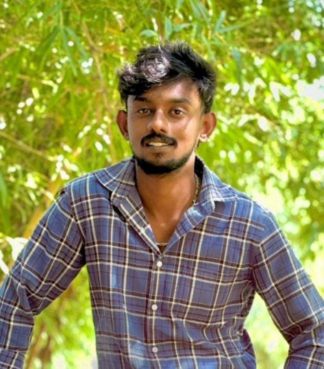 Yashwanth, Project Manager, in a blue checkered shirt, overseeing team workflows and deadlines.